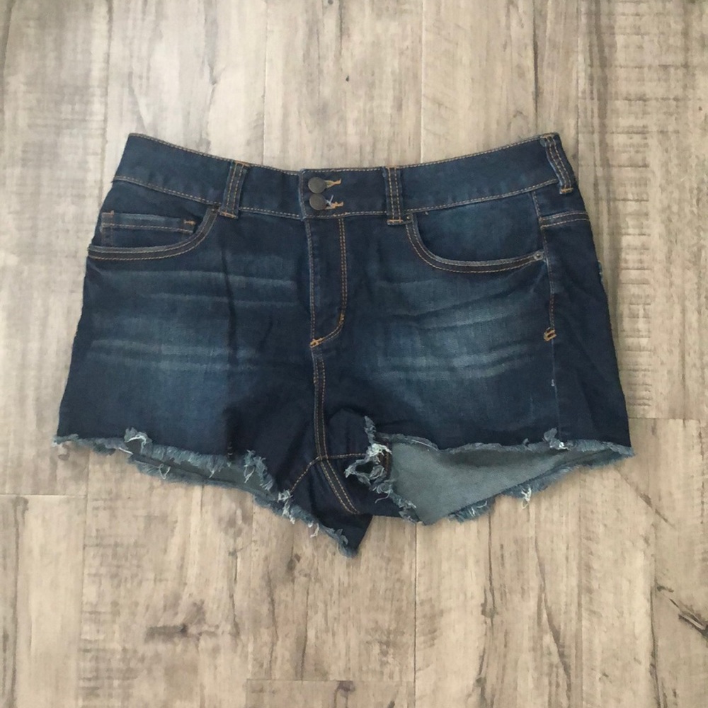 Dark wash denim shorts.
